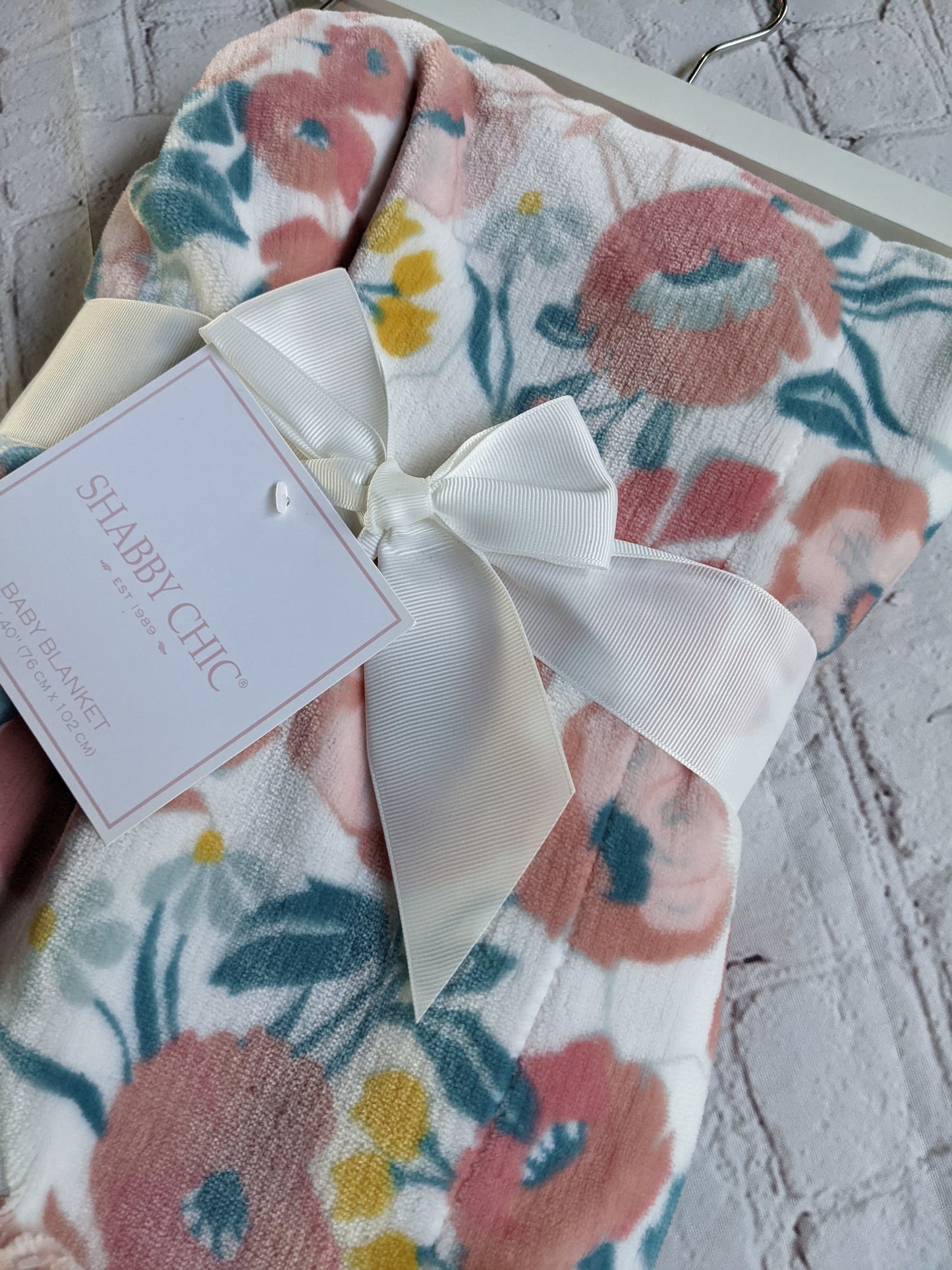 White, Teal, and Pink Floral Blanket